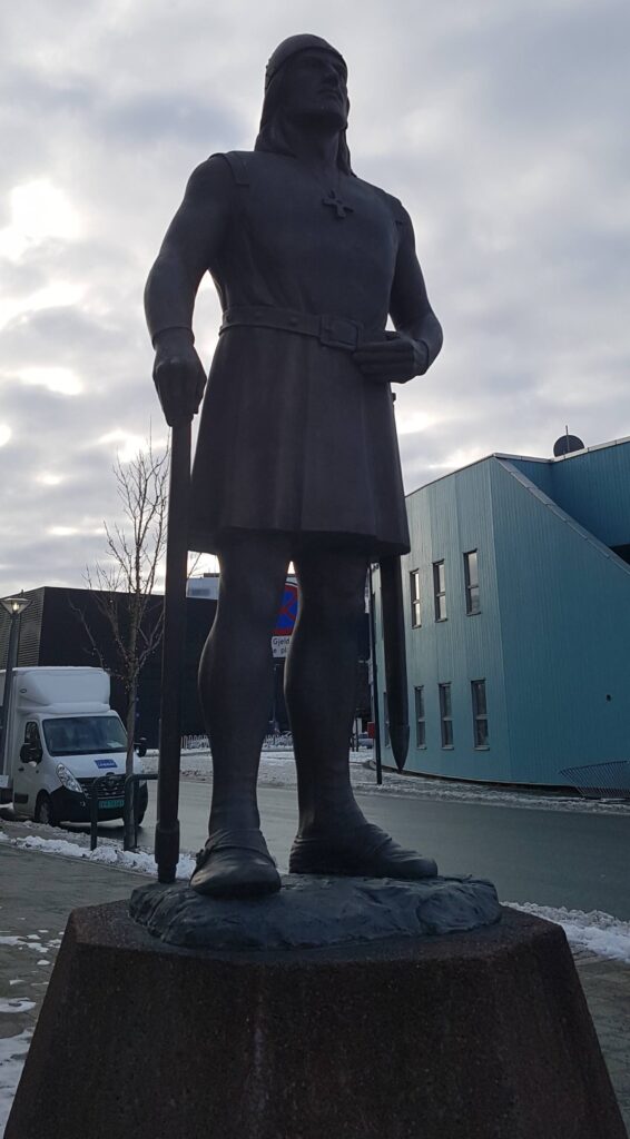 Imposing warrior-looking statue of Leiv Eiriksson in Trondheim, Norway, an important 1000 AD symbol of ethnic pride for Americans of Nordic Heritage. The statue is standing high up on a plinth looking out towards the Trondheim fjord.